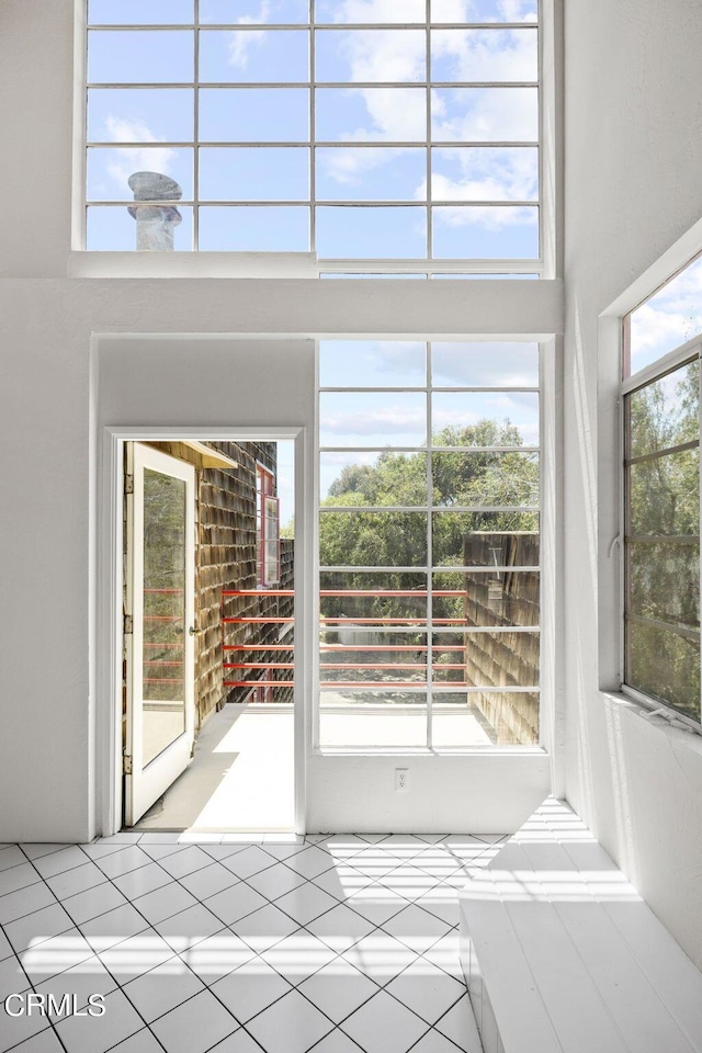 unfurnished sunroom featuring a wealth of natural light