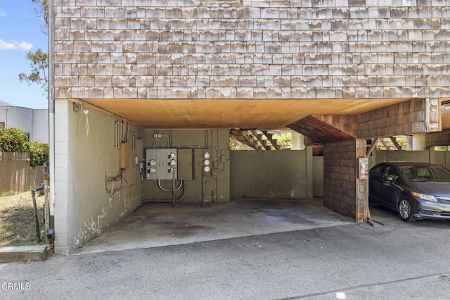 view of parking / parking lot featuring a carport