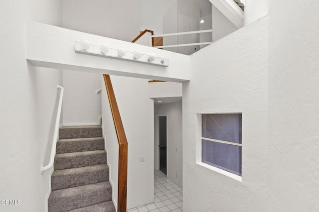 staircase with tile patterned flooring