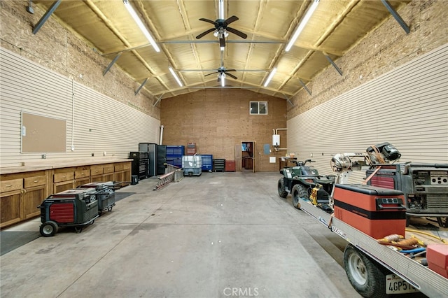 garage featuring a workshop area and ceiling fan