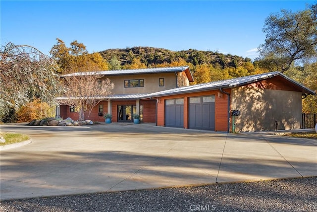 view of front of house featuring a mountain view and a garage