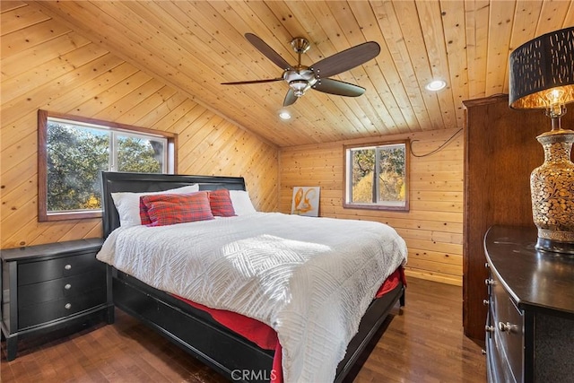 bedroom with ceiling fan, wood ceiling, and wooden walls