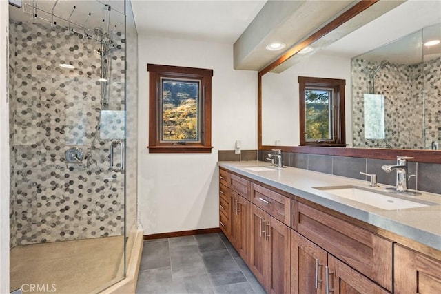 bathroom with vanity, a shower with shower door, and backsplash