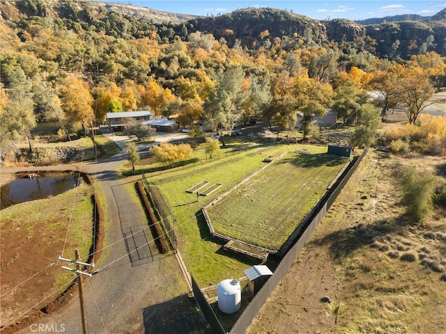 birds eye view of property with a rural view