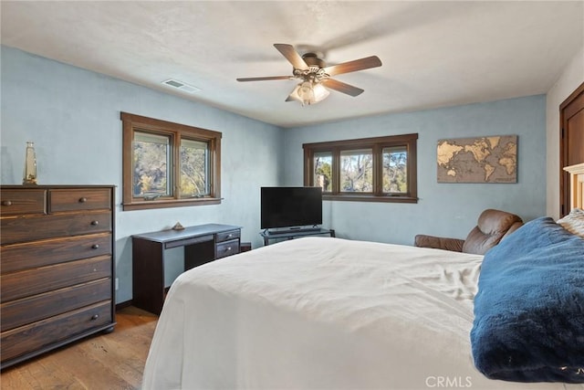 bedroom featuring ceiling fan and light hardwood / wood-style flooring