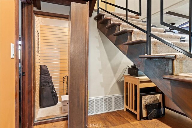 stairway featuring hardwood / wood-style floors