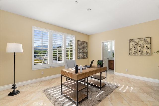 office area with light tile patterned floors