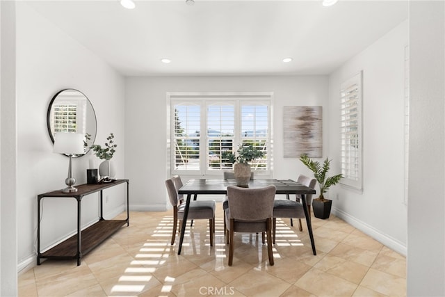 dining area featuring a wealth of natural light and light tile patterned floors