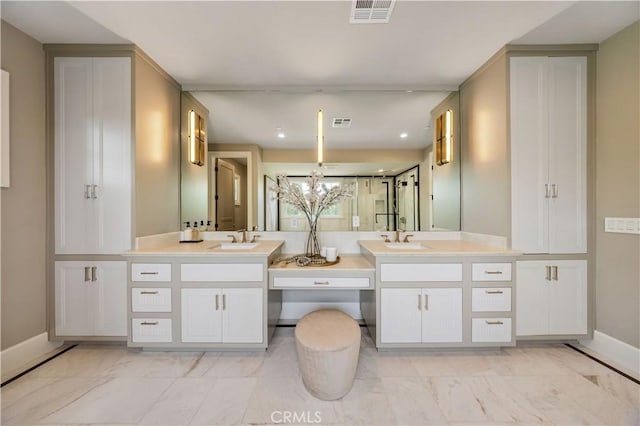 bathroom with vanity and a chandelier