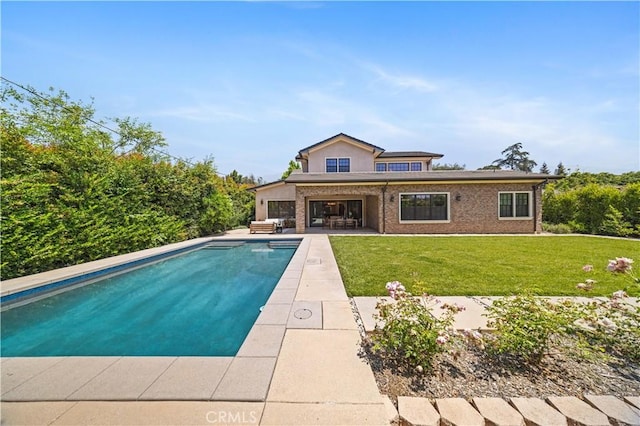 view of swimming pool with a lawn, a patio, and an outdoor hangout area