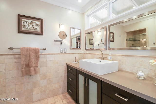 bathroom featuring vanity, backsplash, tile patterned flooring, and tile walls