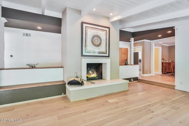 living room with beam ceiling and hardwood / wood-style floors