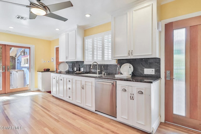 kitchen with white cabinets, sink, backsplash, dishwasher, and ceiling fan