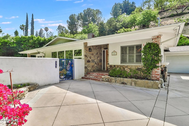 ranch-style house featuring a garage