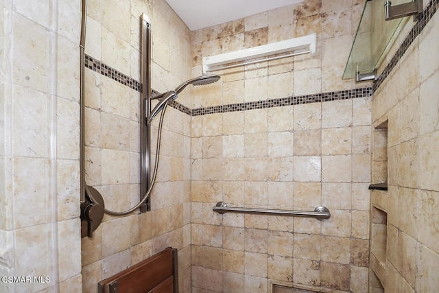 bathroom with a tile shower