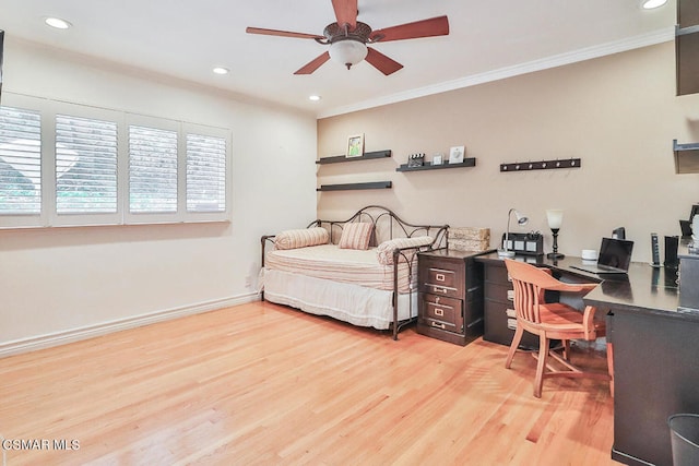 bedroom featuring crown molding, light wood-type flooring, and ceiling fan