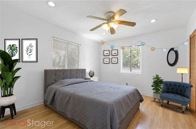 bedroom featuring ceiling fan and light hardwood / wood-style floors