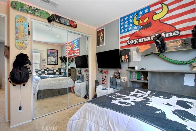 carpeted bedroom featuring a closet