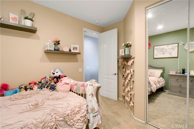 carpeted bedroom with a closet