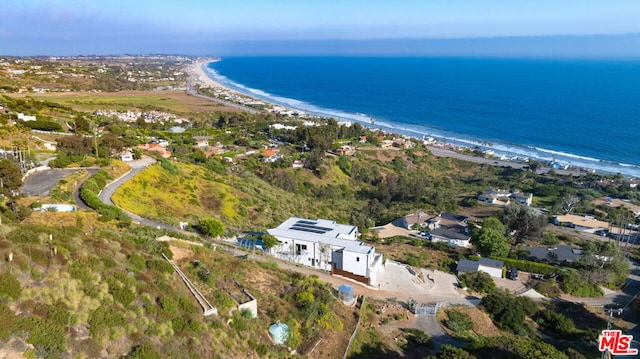 aerial view with a water view and a view of the beach