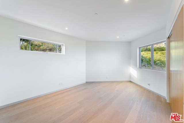 empty room with light wood-type flooring