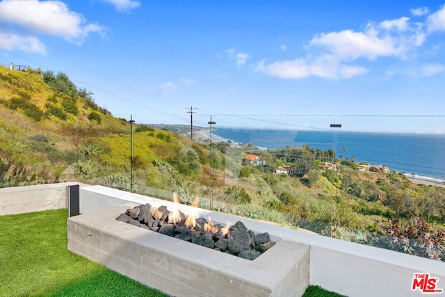 water view with an outdoor fire pit