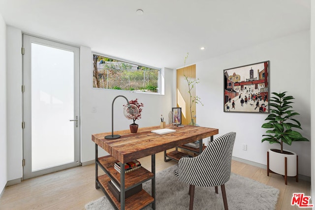 office space with light hardwood / wood-style flooring