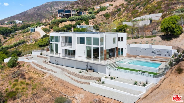 back of house with a mountain view