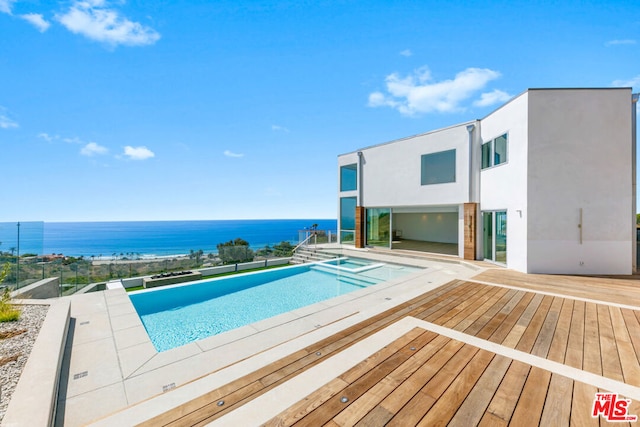 view of swimming pool with a water view