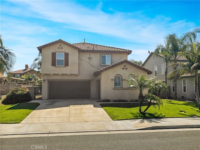 mediterranean / spanish-style home with a garage and a front yard