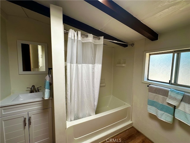 bathroom featuring vanity, hardwood / wood-style flooring, beam ceiling, and shower / bath combo