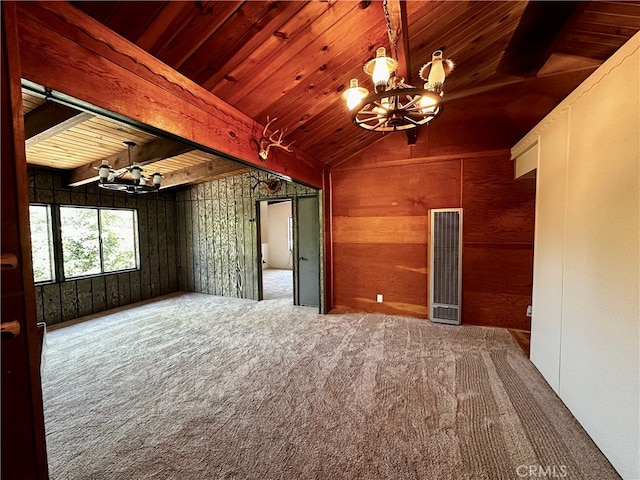 interior space with wood walls, carpet flooring, wood ceiling, a notable chandelier, and lofted ceiling