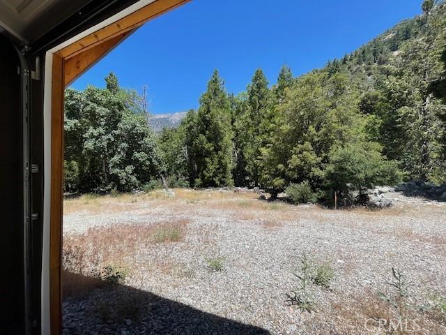 41501 Island Dr, Forest Falls, CA 92339 - view of landscape featuring a wooded view