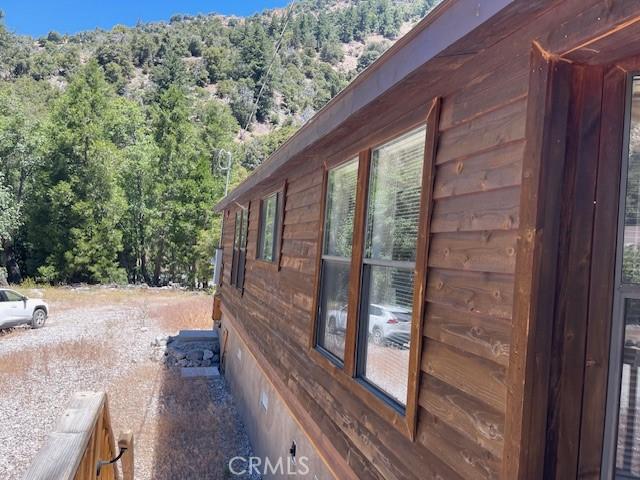 41501 Island Dr, Forest Falls, CA 92339 - view of home's exterior featuring crawl space and a wooded view