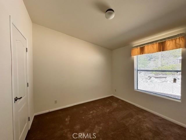 41501 Island Dr, Forest Falls, CA 92339 - unfurnished bedroom with dark carpet and baseboards