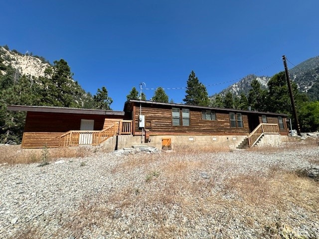 log-style house with a mountain view