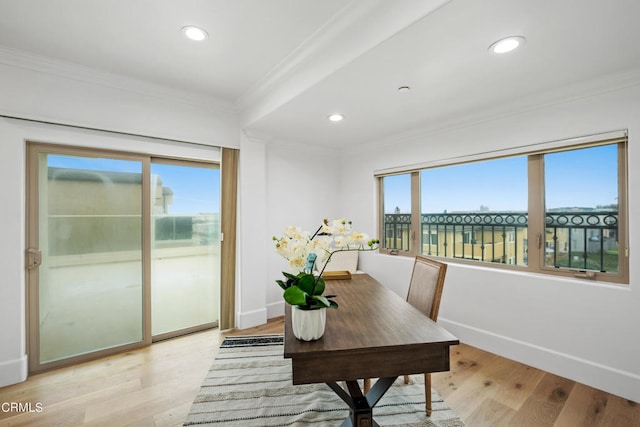 office area featuring ornamental molding and light hardwood / wood-style floors