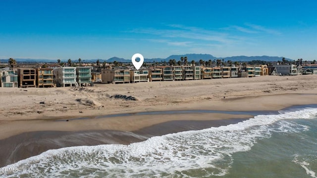 exterior space with a mountain view and a beach view