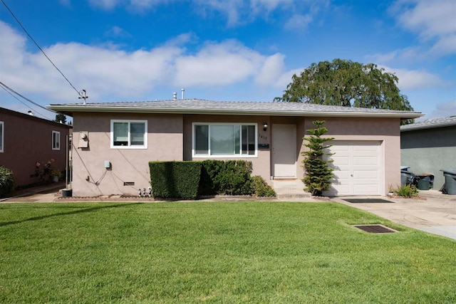 view of front of property with a front lawn and a garage