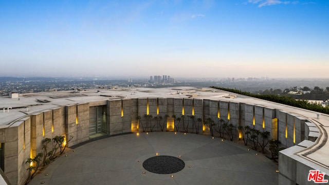 view of patio terrace at dusk