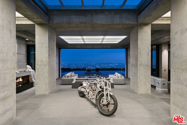 interior space featuring a water view and outdoor lounge area