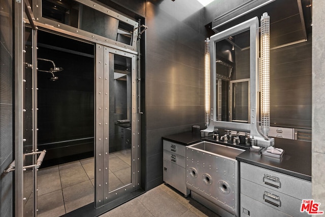 bathroom with tile patterned flooring and sink