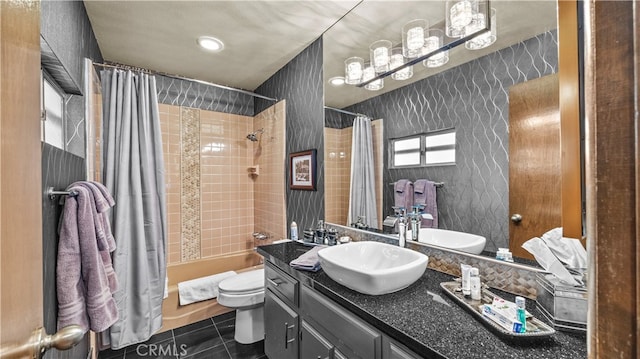 full bathroom with shower / bath combination with curtain, vanity, toilet, and tile patterned floors