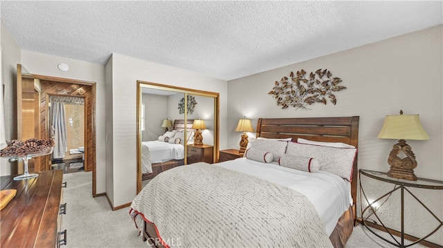 bedroom with a textured ceiling, light colored carpet, and a closet