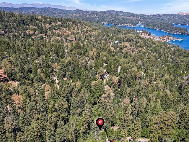 aerial view featuring a water and mountain view