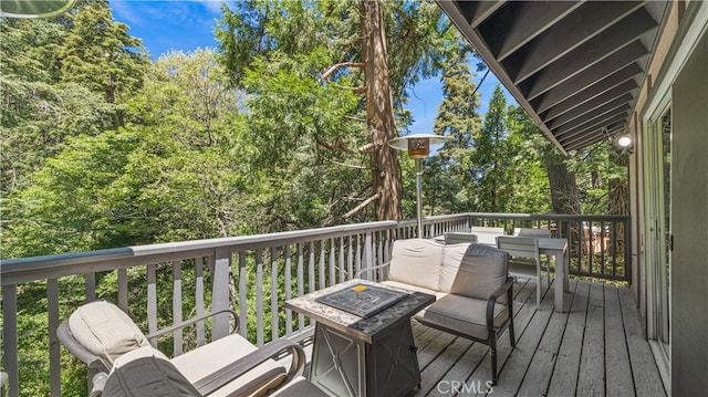 wooden deck with a fire pit