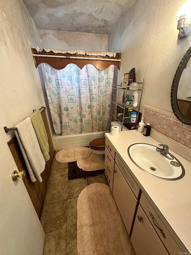 full bathroom with toilet, vanity, tile patterned floors, and shower / tub combo with curtain