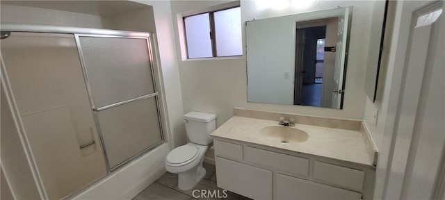 full bathroom with tile patterned floors, vanity, toilet, and enclosed tub / shower combo