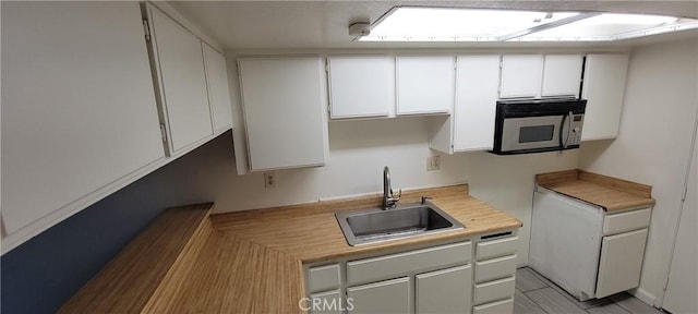 kitchen with white cabinetry and sink