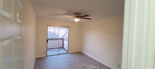 unfurnished room featuring hardwood / wood-style flooring and ceiling fan